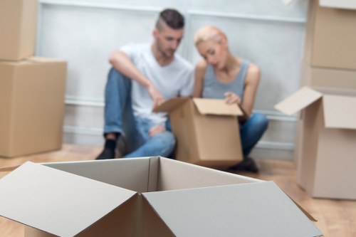 Packed boxes and furniture ready for local van removal service in Brimsdown