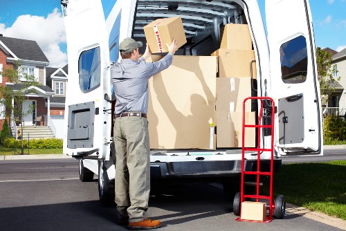 Loading furniture into a removal truck in Brimsdown