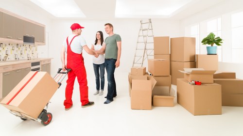 Commercial moving team handling office furniture