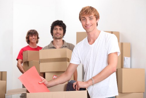 Packed boxes and furniture ready for home moving in Brimsdown